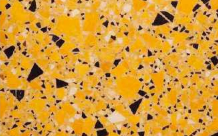 Terrazo Yellow Electric — amarillo saturado con agregado negro y hueso